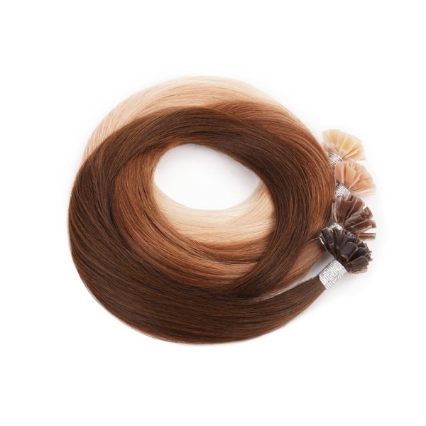 Four bundles of U-Tip hair extensions rolled up in a full circle