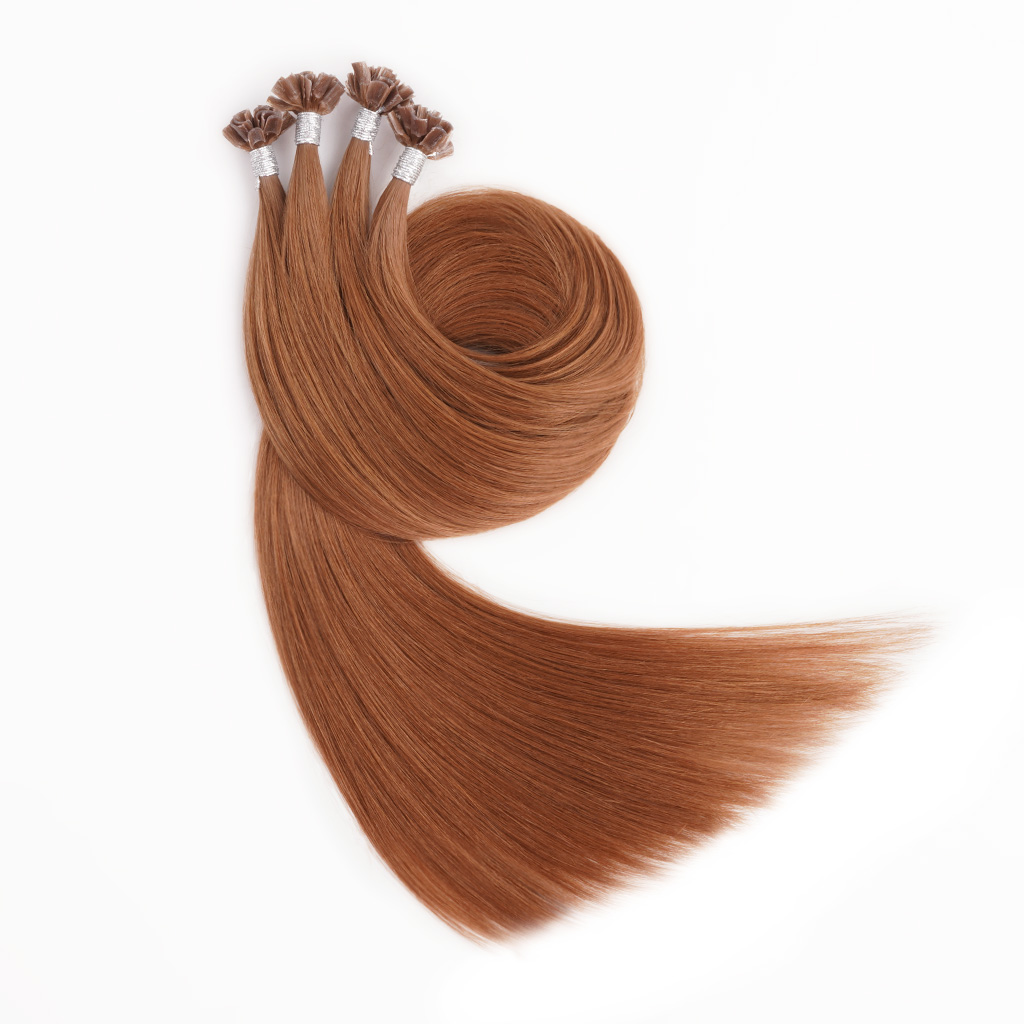 A bunch of U tip Hair extensions 7-Star Full Cuticle Remy Hair in a caramel color